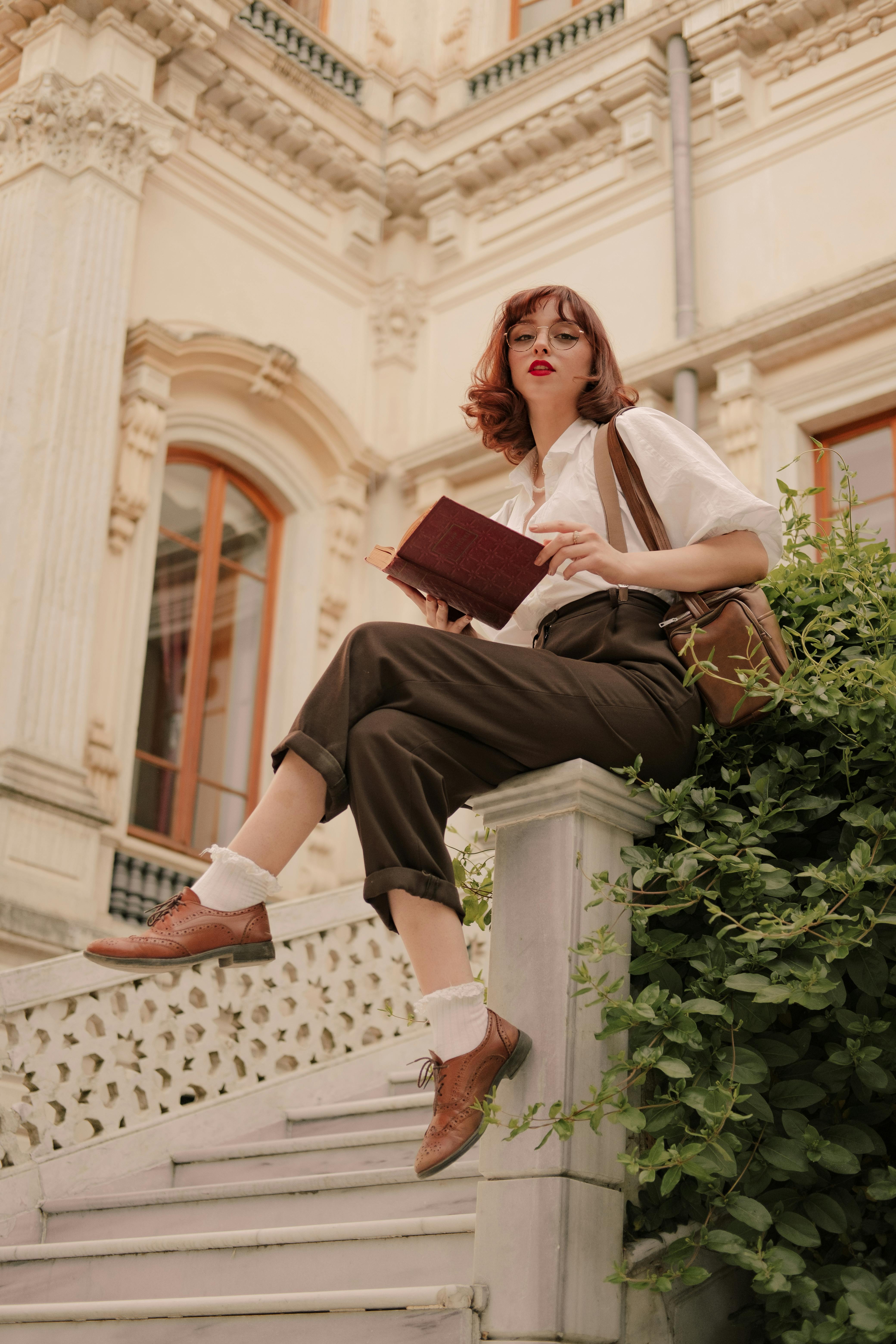 portrait of woman with book and purse