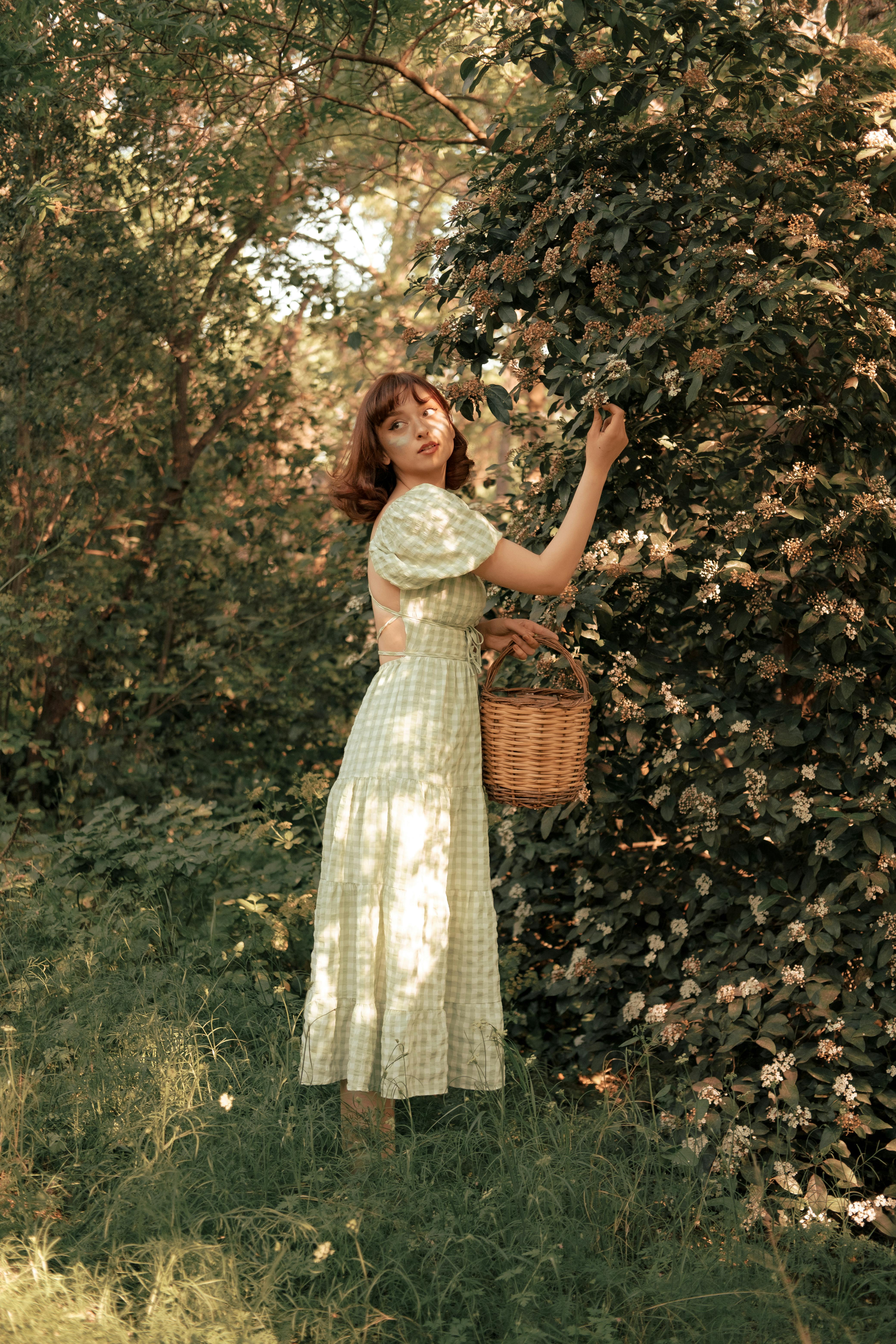 portrait of woman with basket and flowers