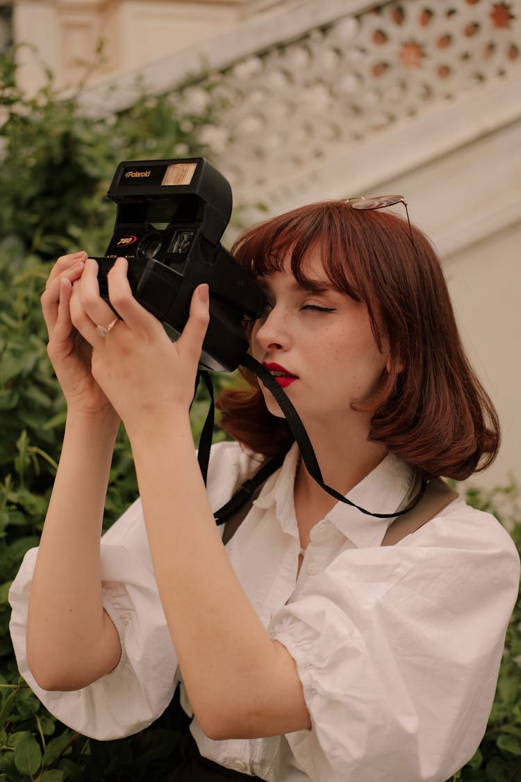 Portrait Of Woman With Vintage Camera