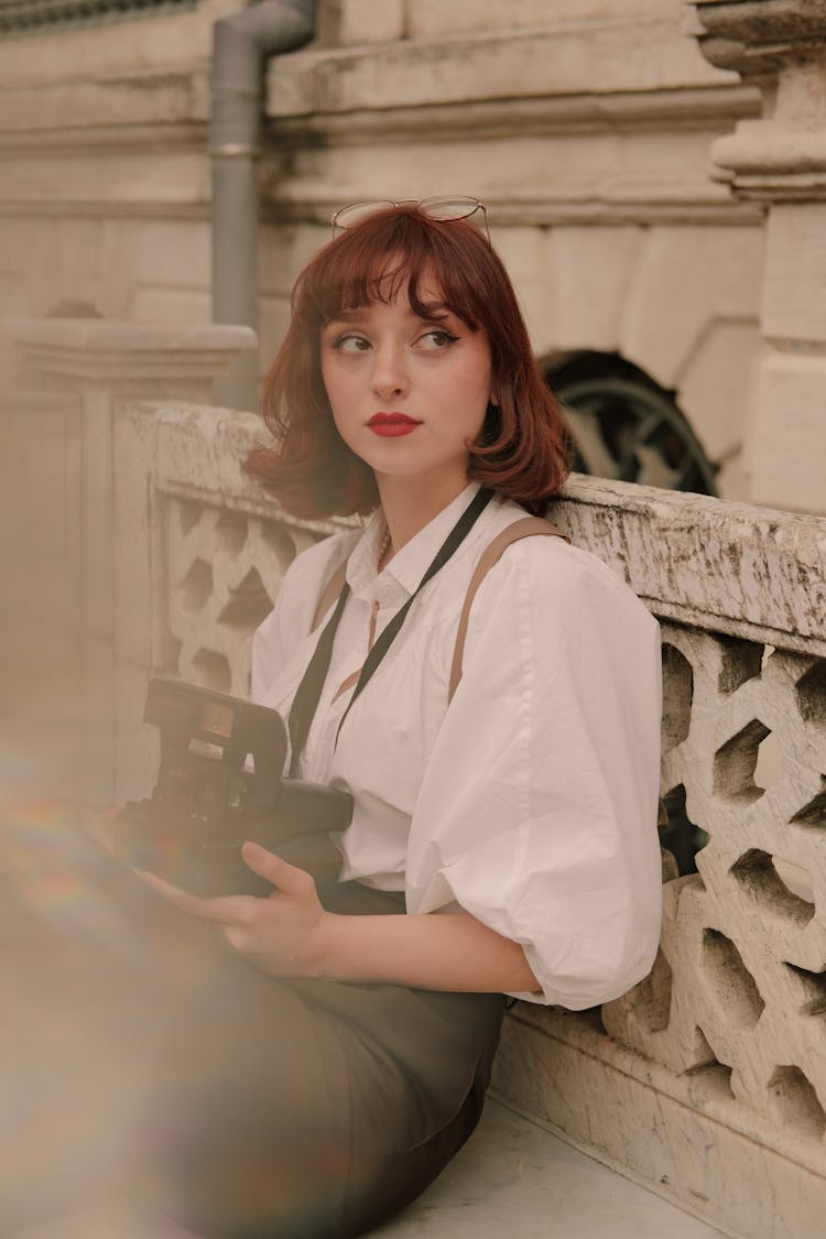 Retro Style Portrait Of Woman With Vintage Camera