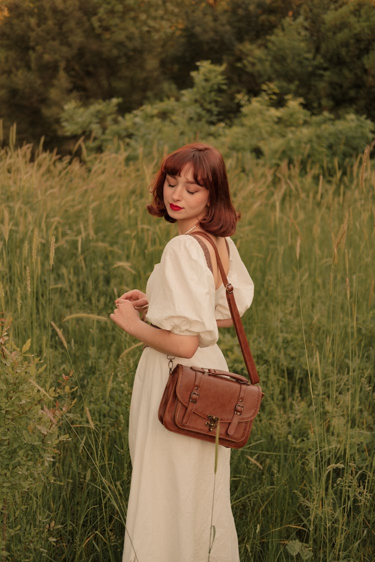 Retro Portrait Of Woman In Dress With Purse