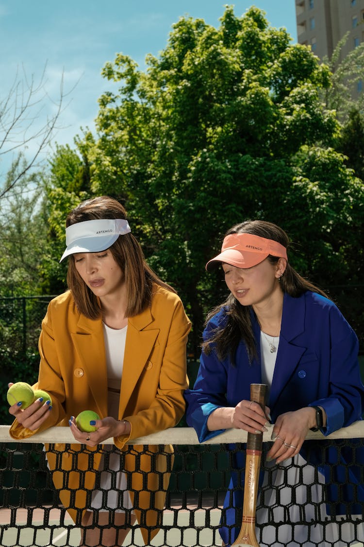 Women With Rackets On Tennis Court