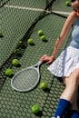Woman in White Dress Holding Tennis Racket