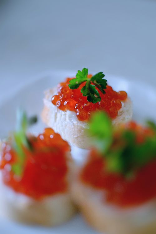 Free Delicious appetizer featuring caviar on bread garnished with parsley, perfect for upscale events. Stock Photo