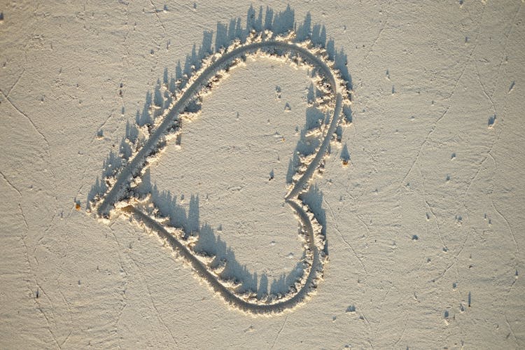 Heart Drawing On The Beach Sand