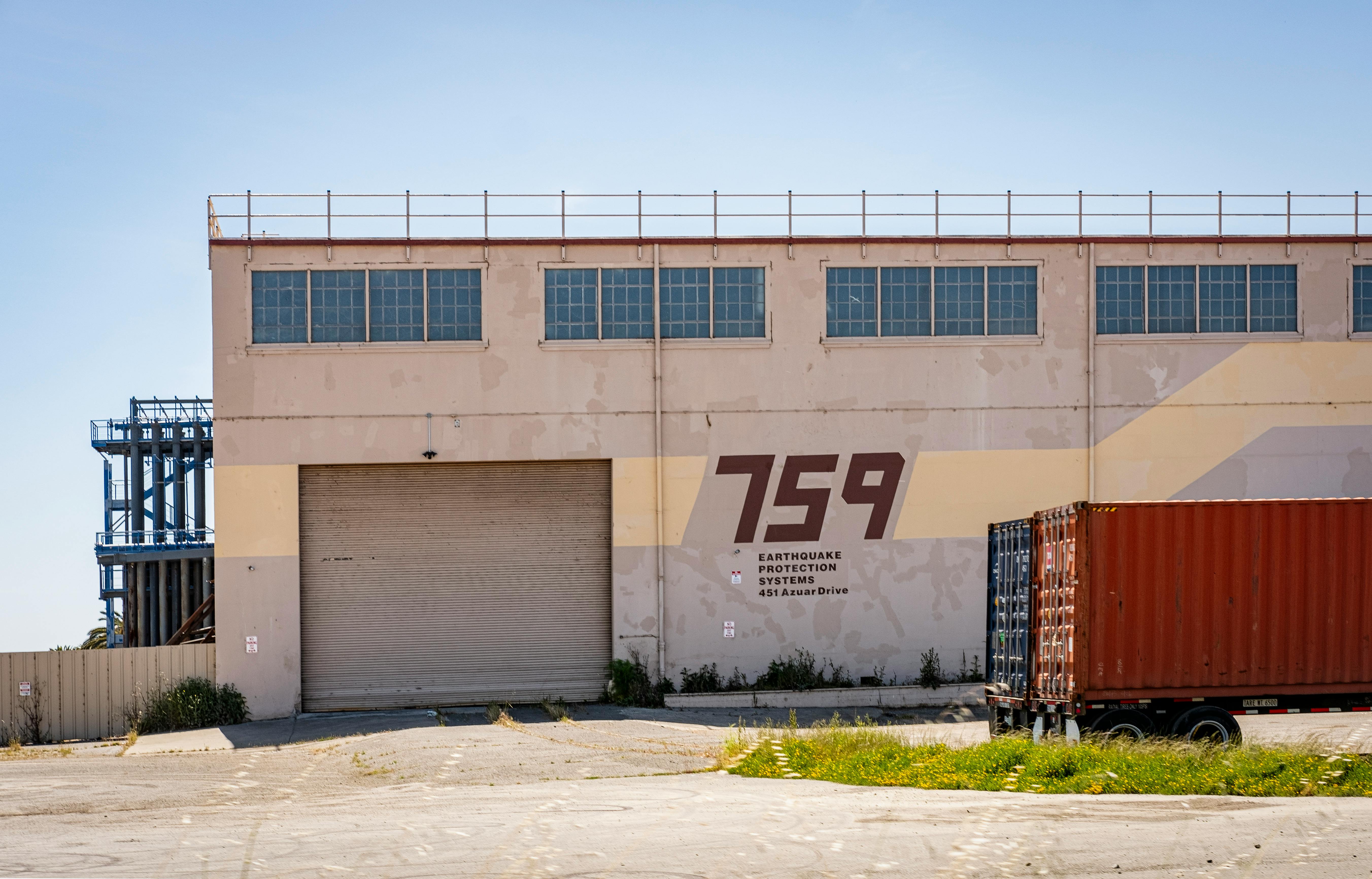 Warehouse in Vallejo with earthquake protection systems on a sunny day.