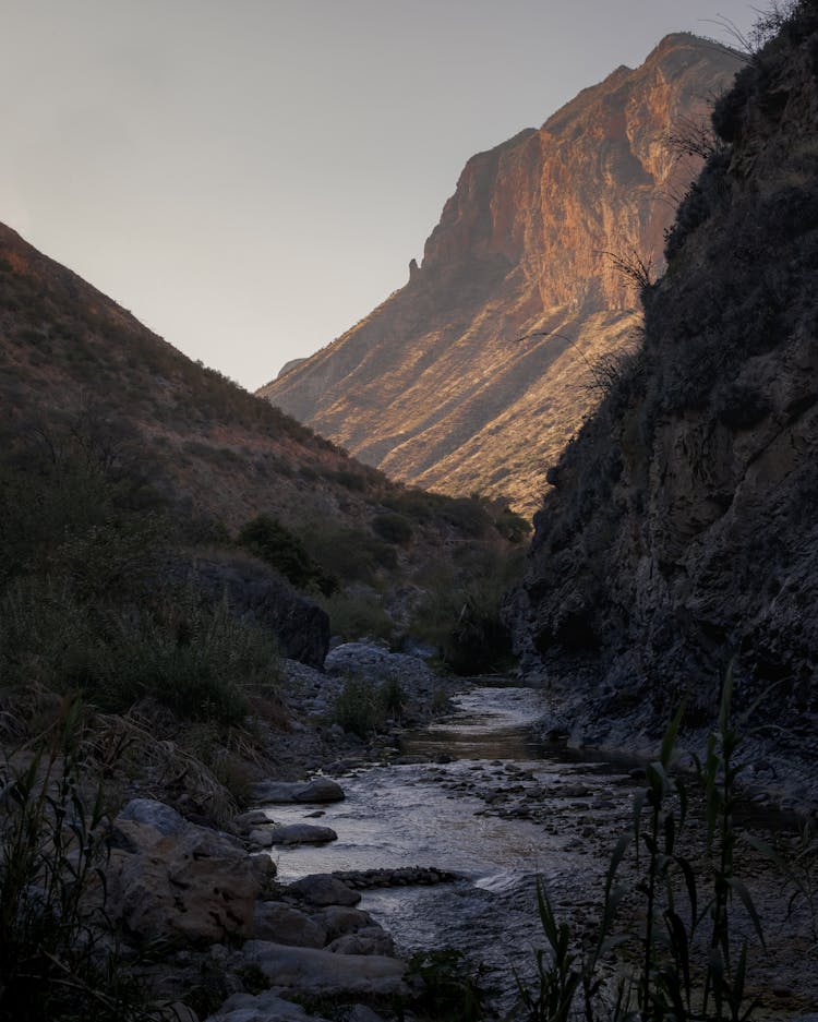 Flowing River Between Mountains