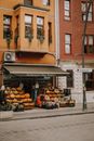 A Fruit Stand Outside the Brown Concrete Building