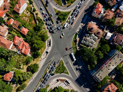 Drone shot capturing a busy intersection in Plovdiv, showcasing roads, cars, and urban architecture.