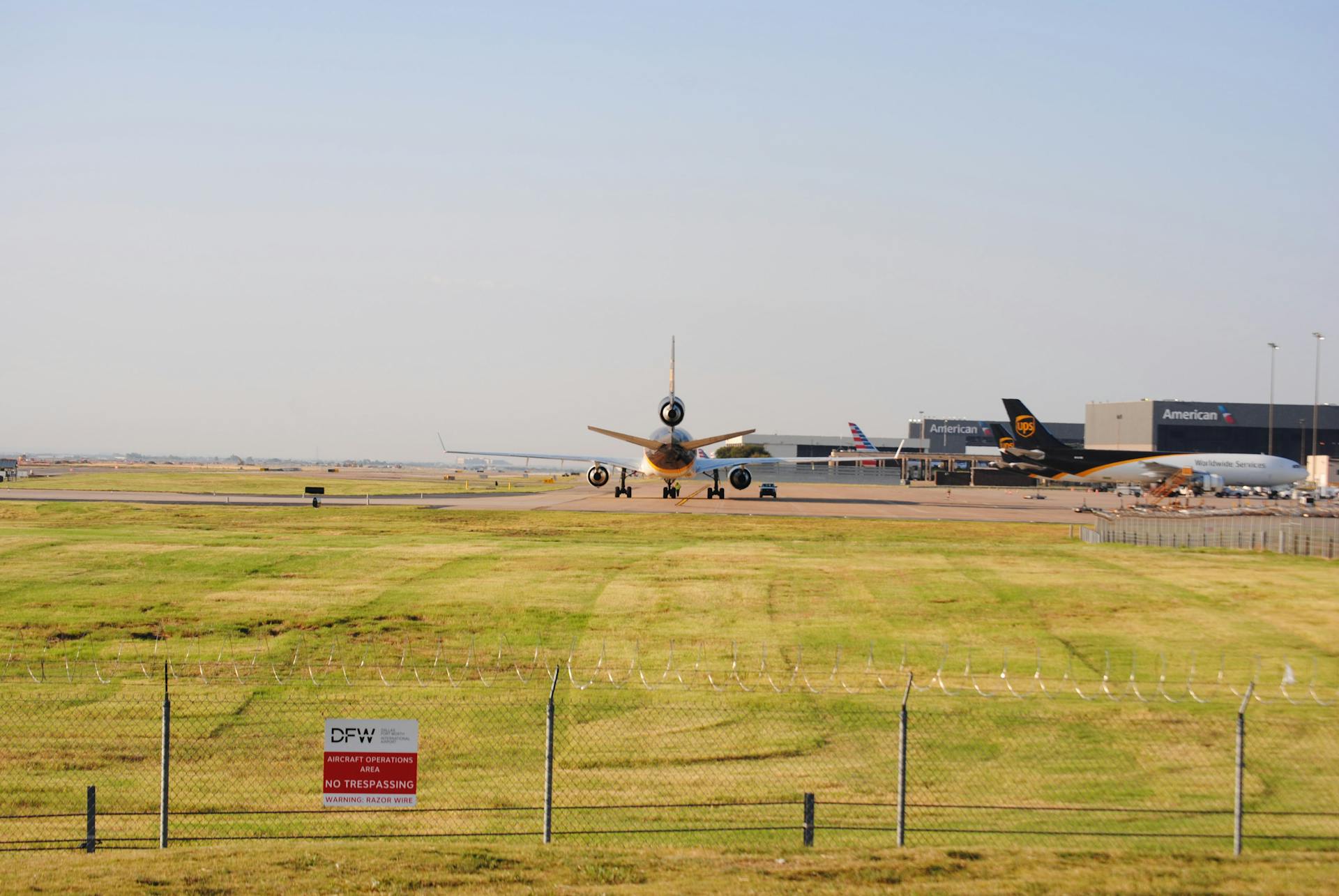 A wide view of planes taxiing at DFW Airport in Grapevine, Texas. Perfect for aviation and travel themes.