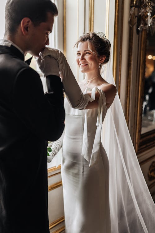 Bridegroom Kissing His Brides Hand 