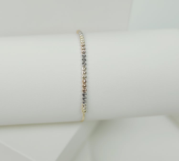 Gold Bracelet On White Surface