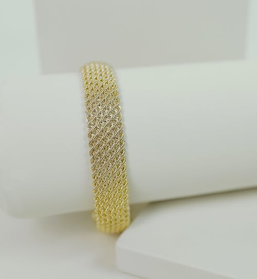 Close-Up Shot of a Gold Bracelet 