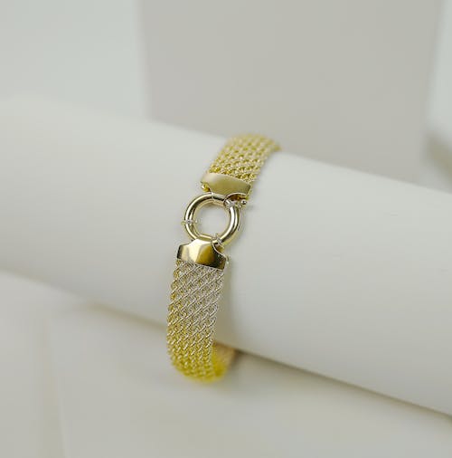 Gold and Silver Link Bracelet on a Holder