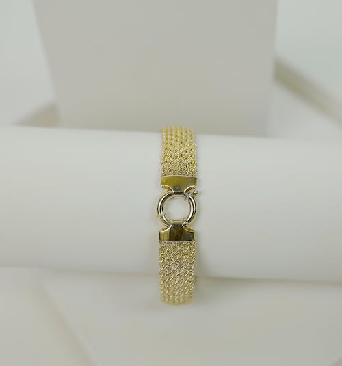 Close Up Photo of a Gold Bracelet