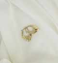 Gold Diamond Ring on White Textile