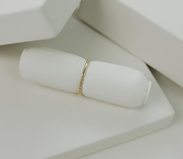 A Gold Ring On Ring Holder