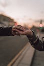 Couple Holding Hands in the Street