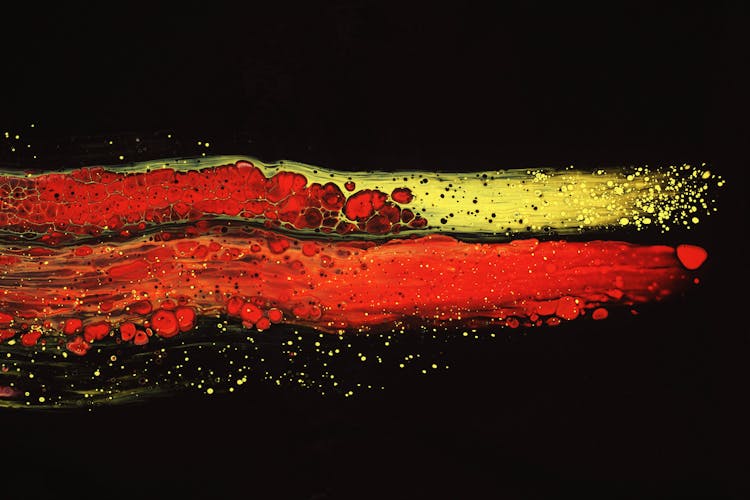 Red And Yellow Abstract Painting On Dark Background