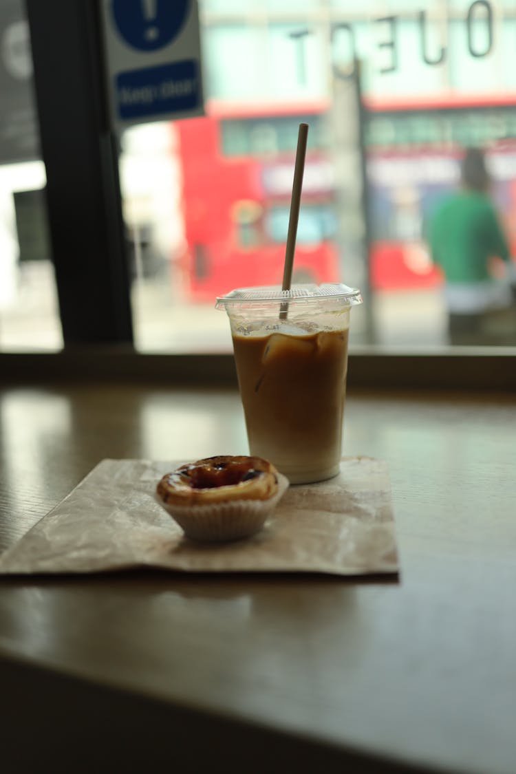 Muffin And Coffee On Table In Cafe