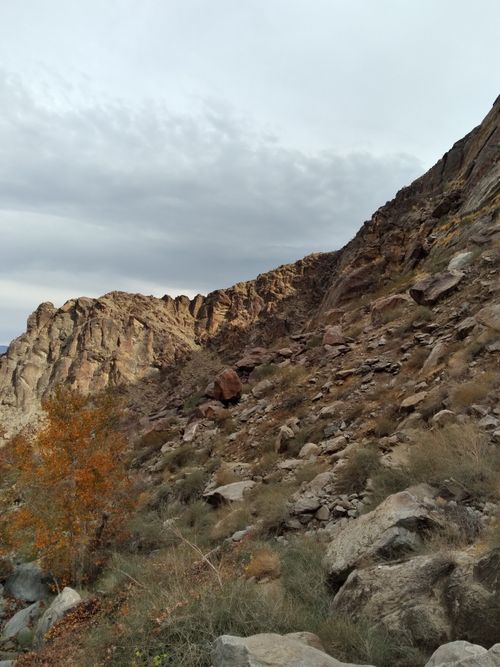 Free Explore the rugged beauty of a rocky mountainside beneath a cloudy sky, ideal for nature photography enthusiasts. Stock Photo