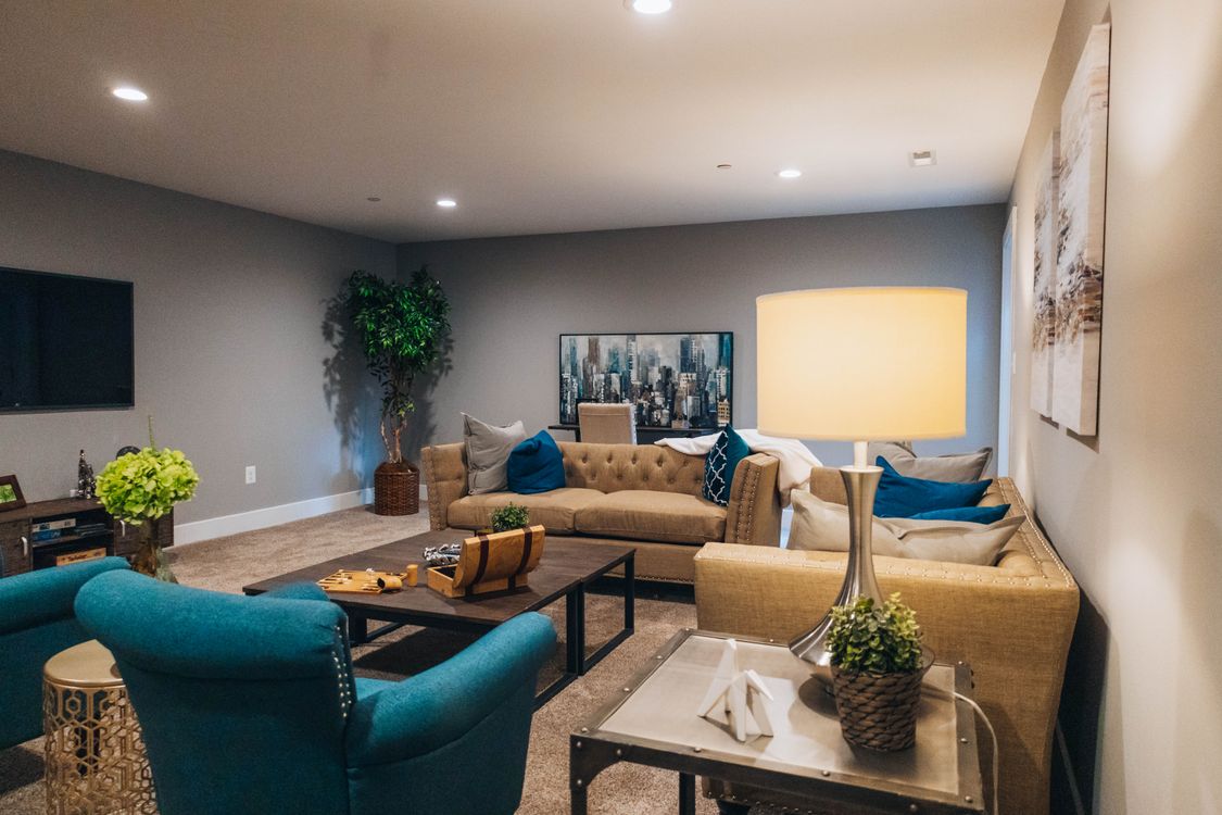 Brown and Blue Sofa Set in the Living Room · Free Stock Photo