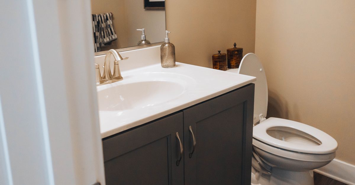 A clean, modern bathroom with a sink and toilet, ideal for home decor inspiration.