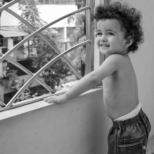 Grayscale Photo of a Boy 