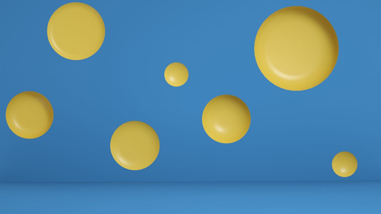 vivid abstract design of yellow circles floating on a blue background