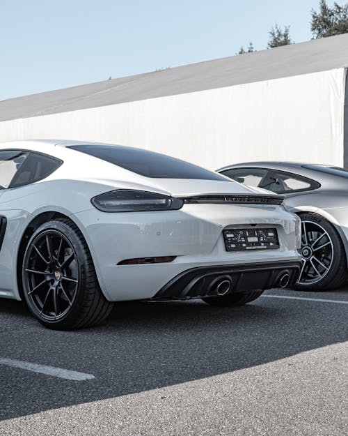 Two Luxury Cars in the Parking Area