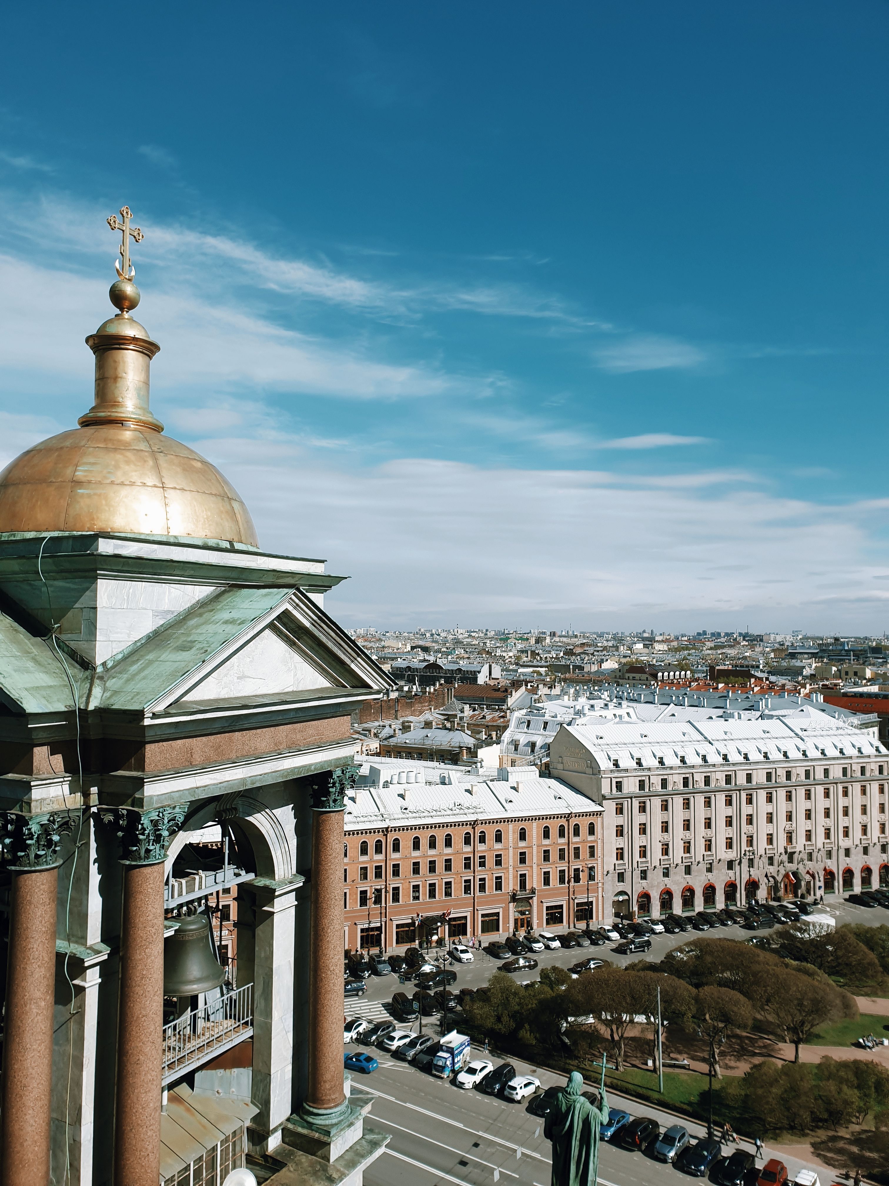A stunning view of St. Petersburg's historic skyline featuring a golden-domed cathedral.