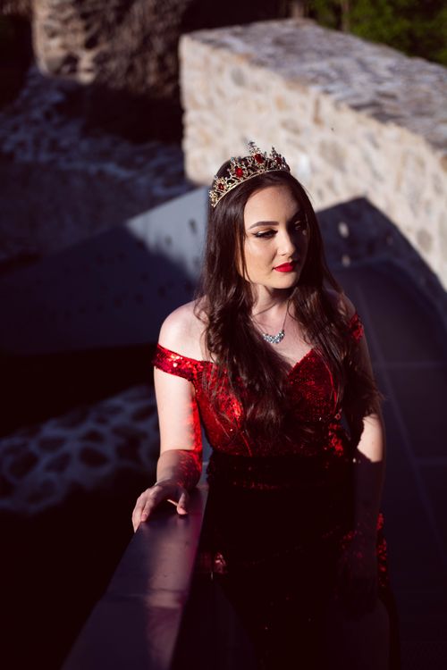 Elegant Woman in Red Sparkling Dress and a Crown · Free Stock Photo
