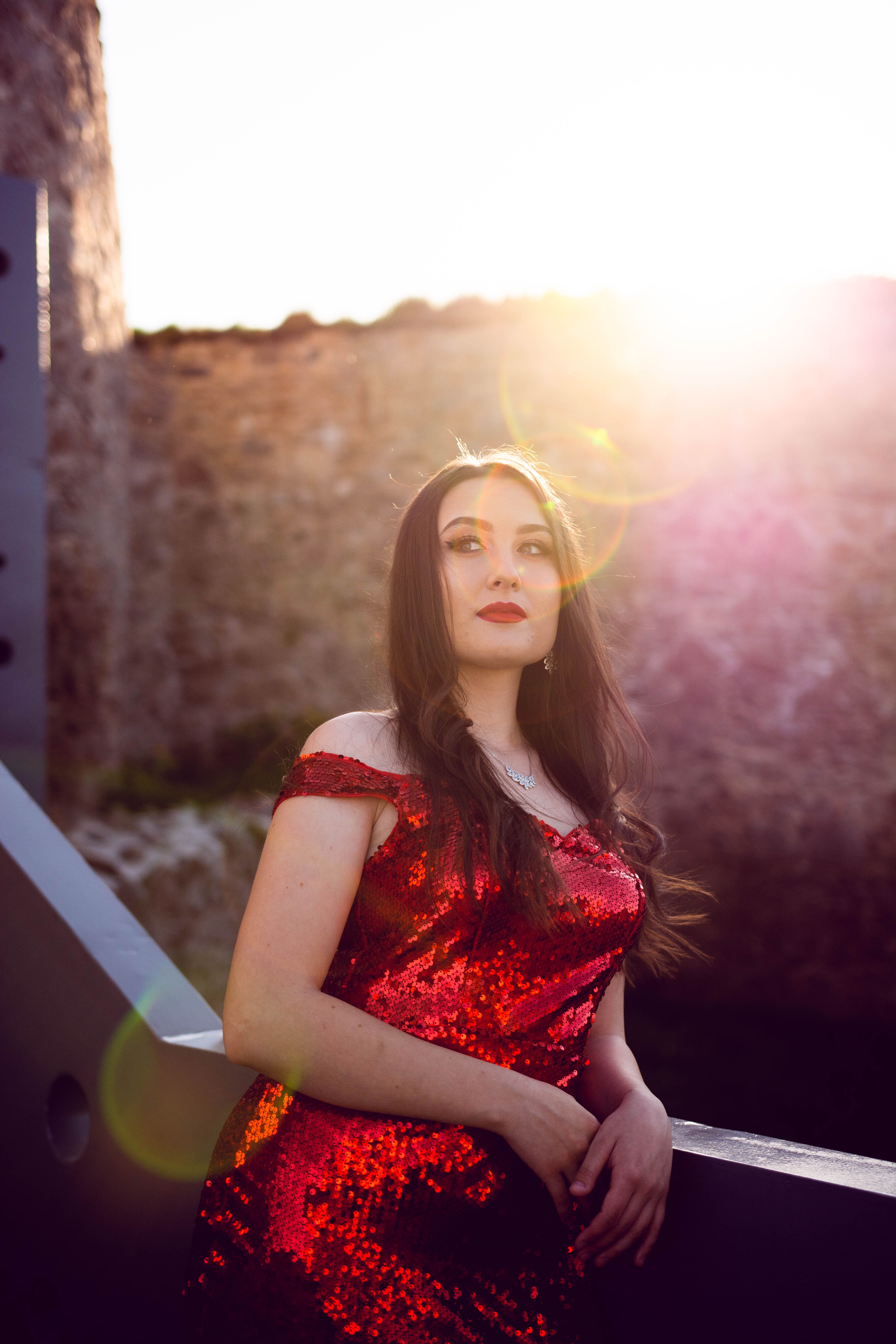 Elegant Woman in Red Sparkling Dress · Free Stock Photo