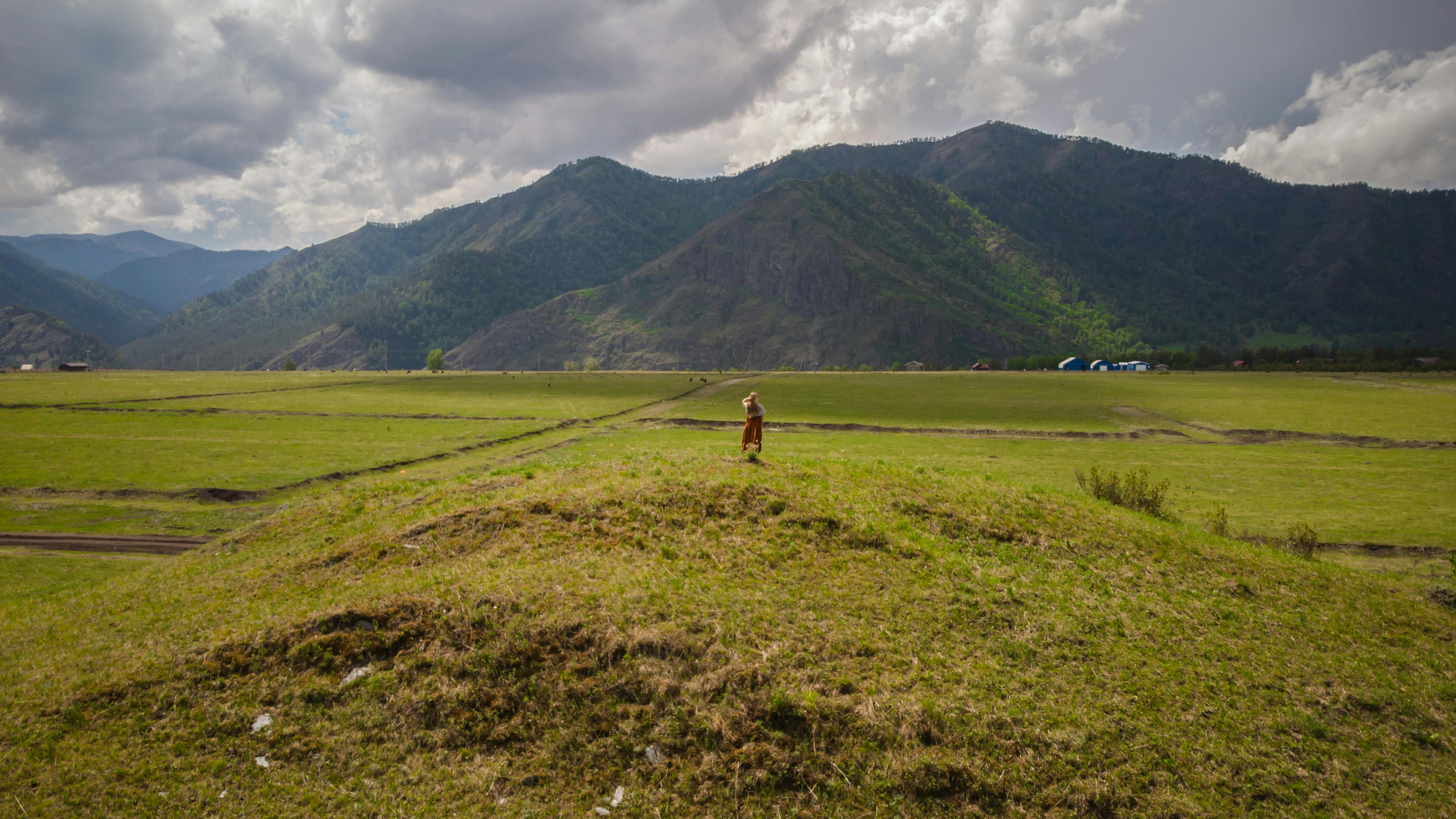 Green Grass Field Near Mountain · Free Stock Photo