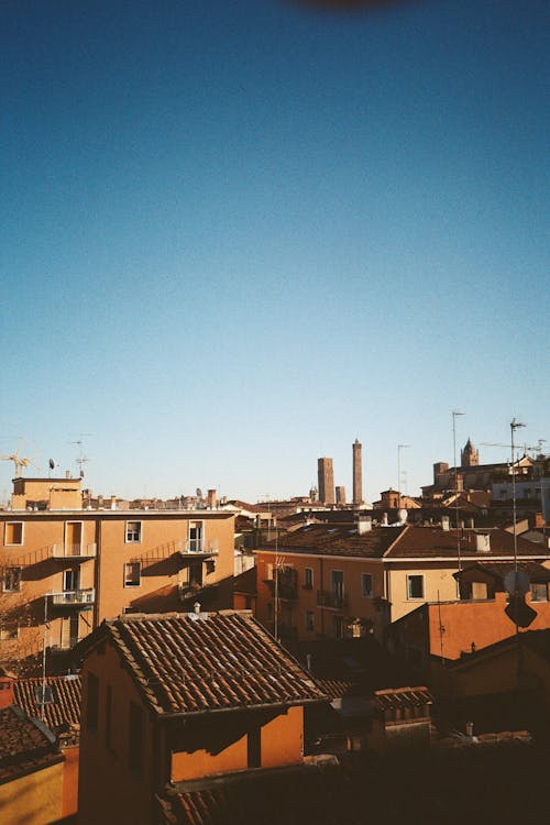 Brown Concrete Buildings Under Blue Sky