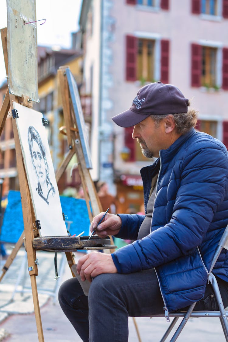 Middle-aged Man In Front Of A Painting 