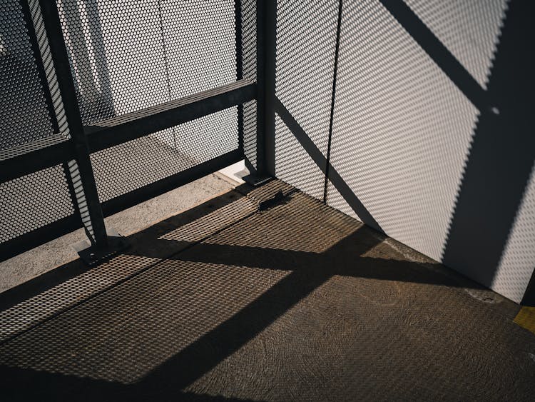 Handrails Shadow On Building Wall And Floor