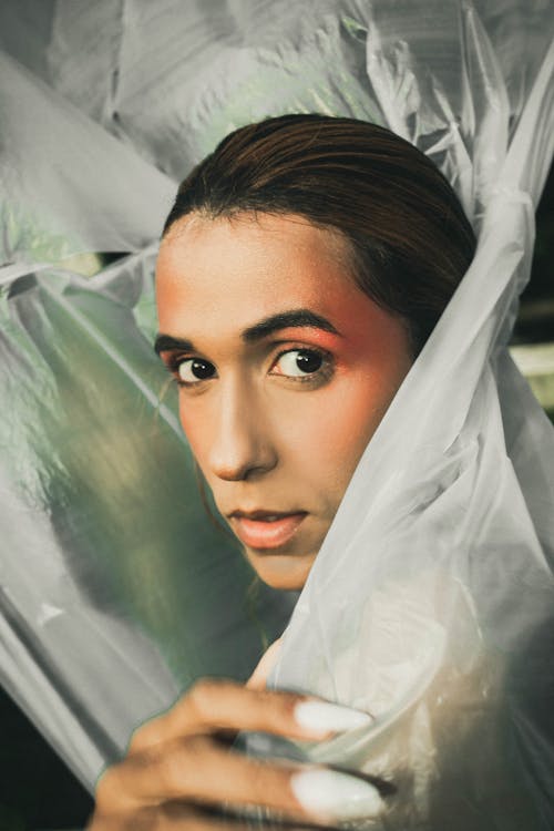 Woman Wrapped with Clear Plastic While Posing 