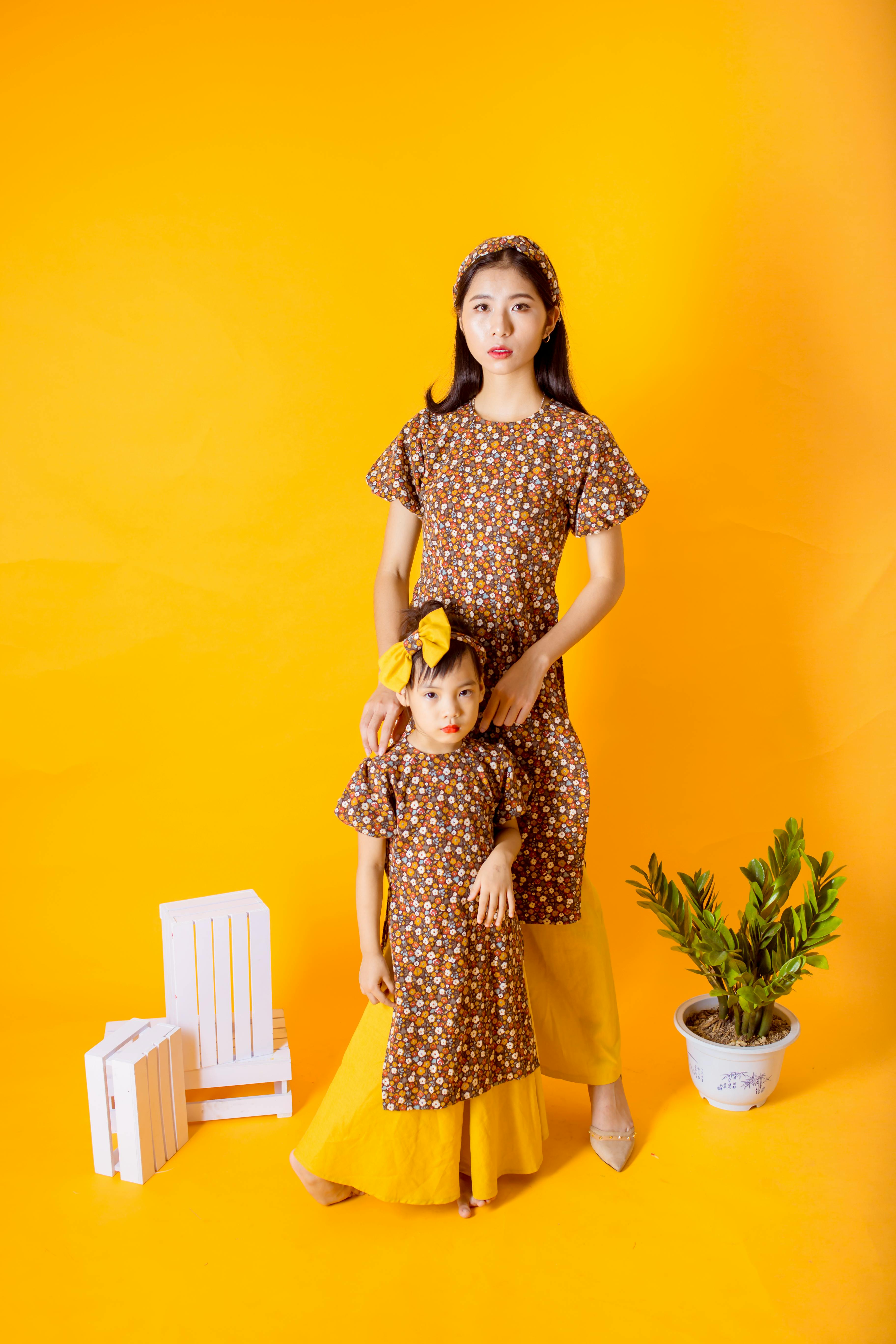 A Mother and Daughter wearing the Same Dress · Free Stock Photo