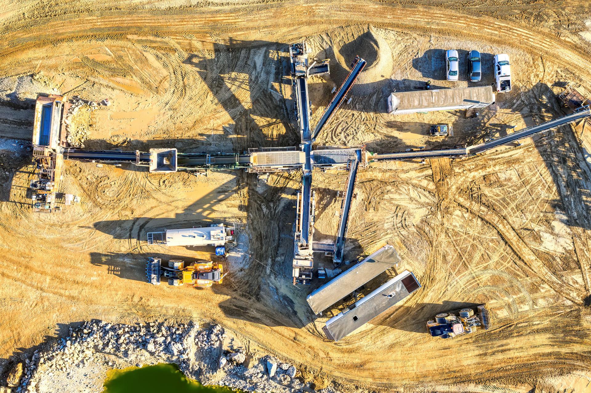 Drone capture of an industrial mining site in Rochester, showcasing heavy machinery and equipment.