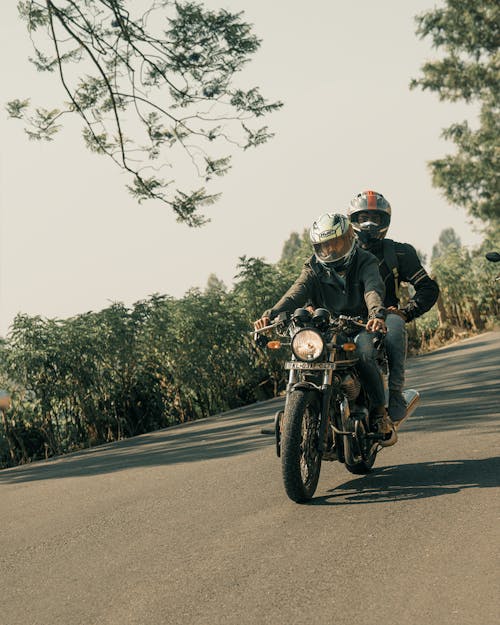 Free Man in Black Helmet Riding Motorcycle on Road Stock Photo