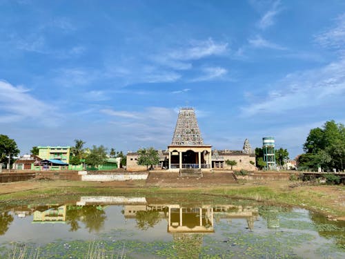 Small Lake in a Park with a South Indian Temple in the Background
