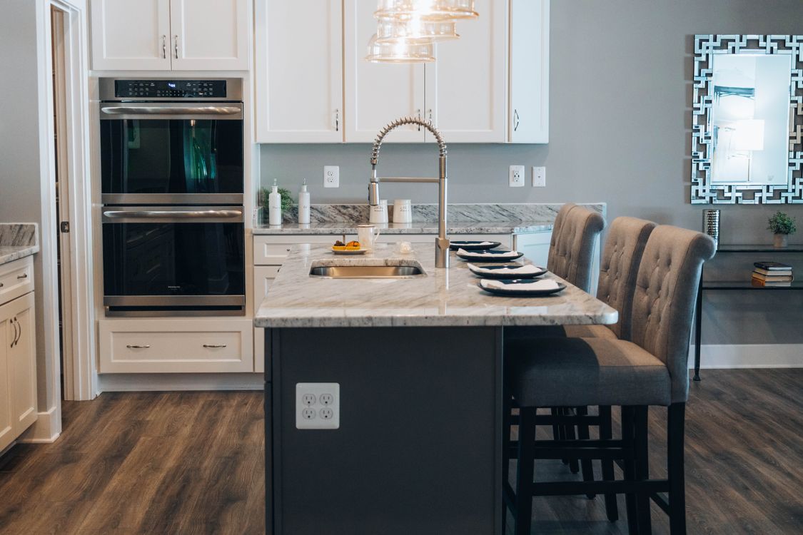 Contemporary kitchen with marble island and seating