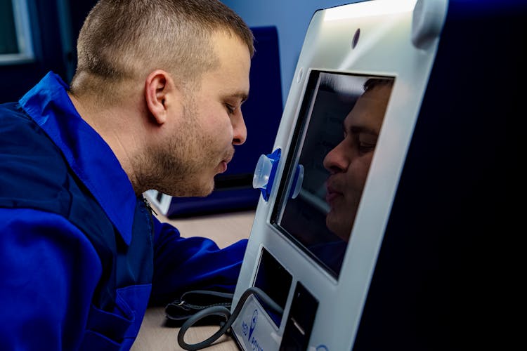 Man Using A Telemedicine Machine 