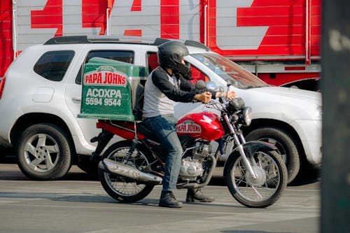 Delivery Man Riding a Motorcycle