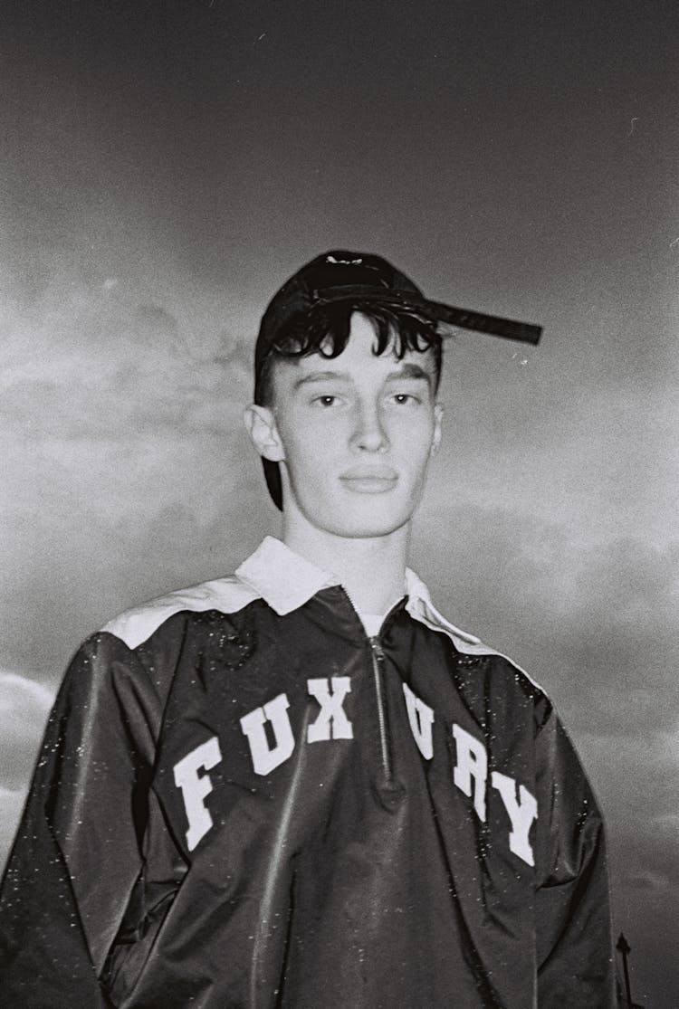 Young Man Wearing A Cap Backwards