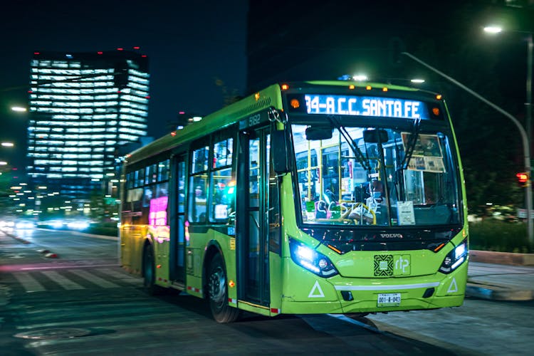 A Green Bus On A Road