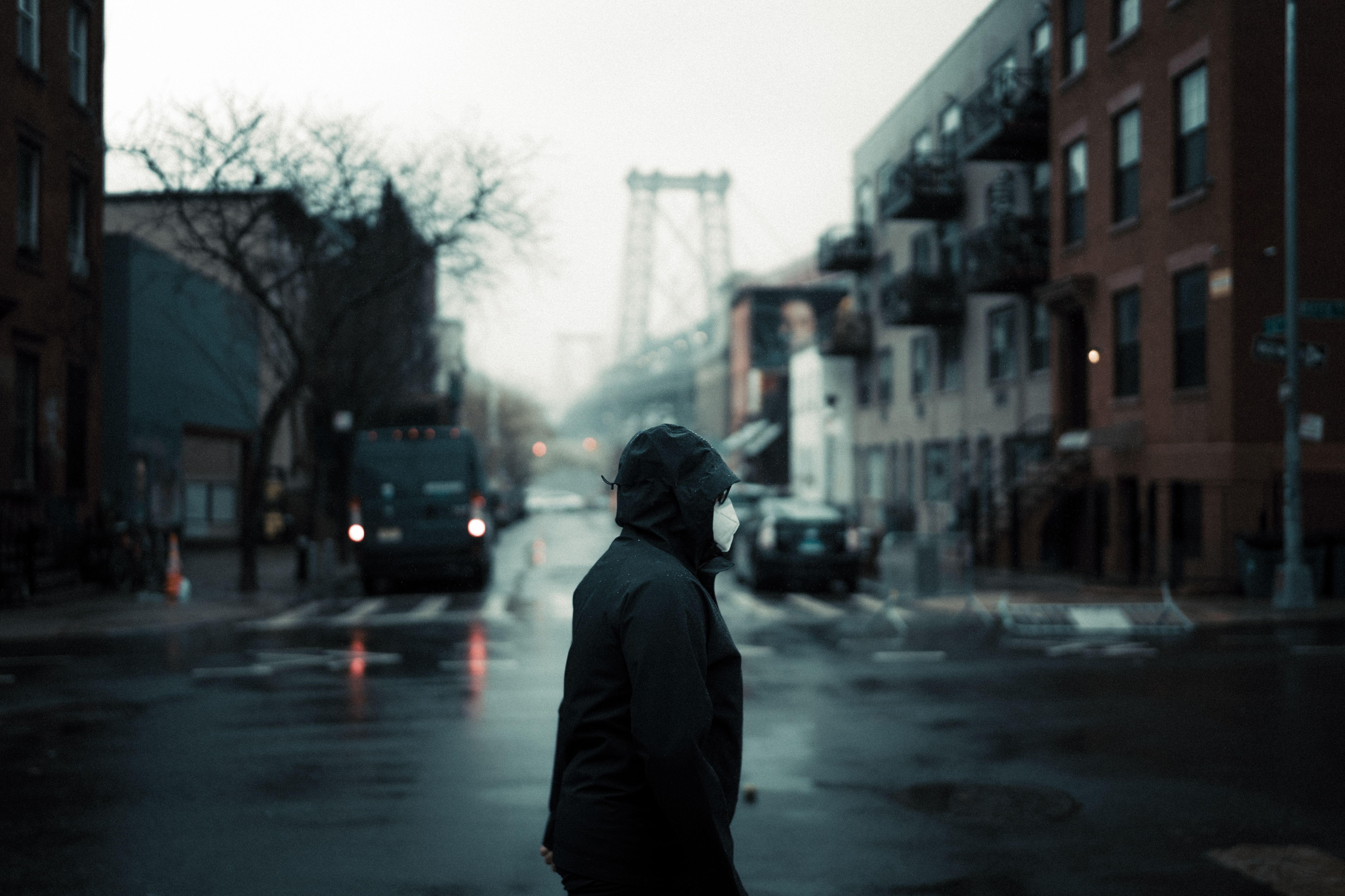 person wearing mask foggy street