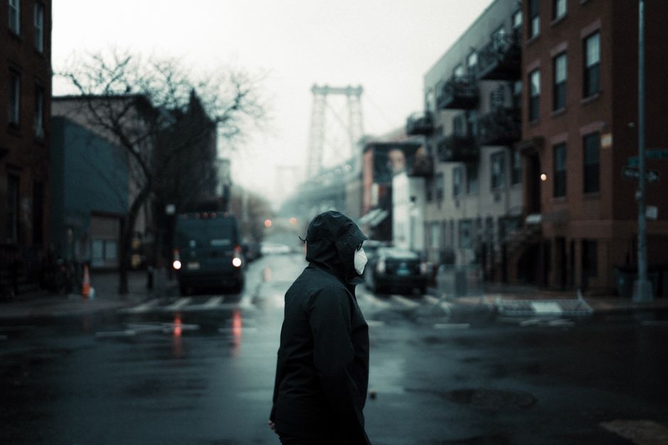 person wearing mask foggy street