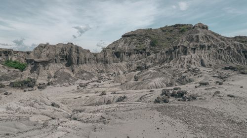 Free Explore the striking eroded rock formations in Colombia's barren wilderness under a vast sky. Stock Photo